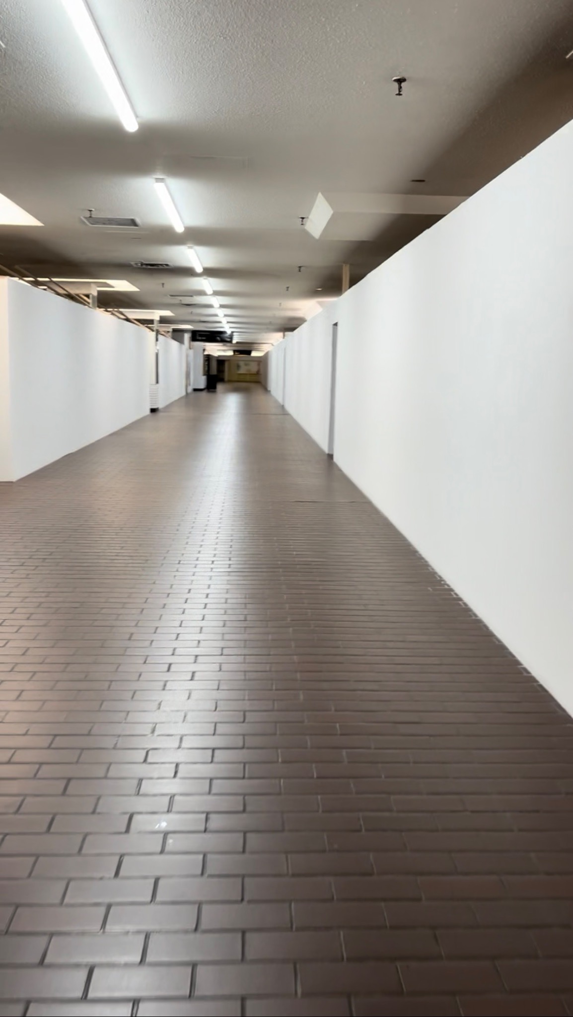 White drywall lining a corridor at Cumberland Terrace in Toronto, where the food court is no longer accessible.